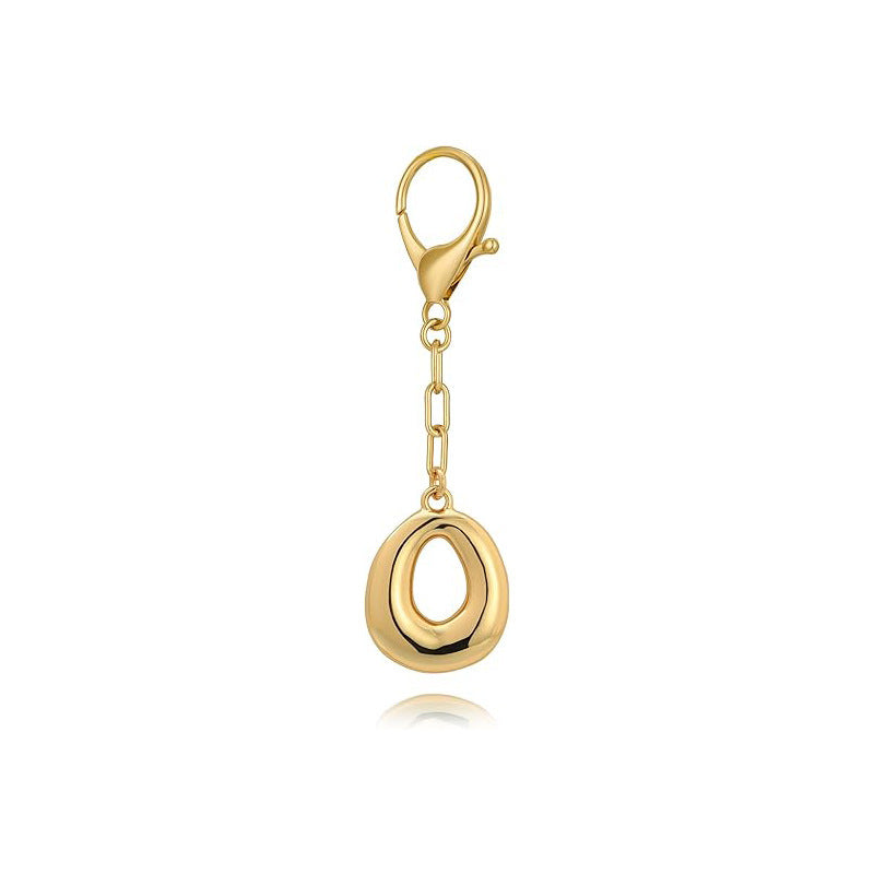 Gold letter 'O' keychain with clasp on a white background
