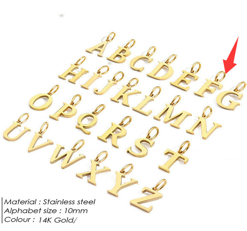 Gold letter pendants for a personalised necklace on a white background with a red arrow pointing to 'F'.