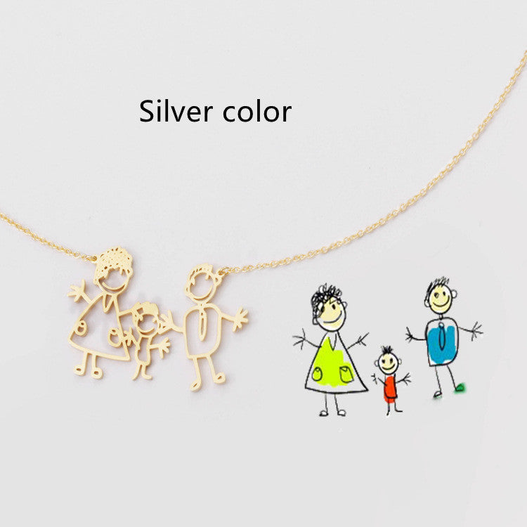 Gold necklace with stick figure family pendant on a light grey background