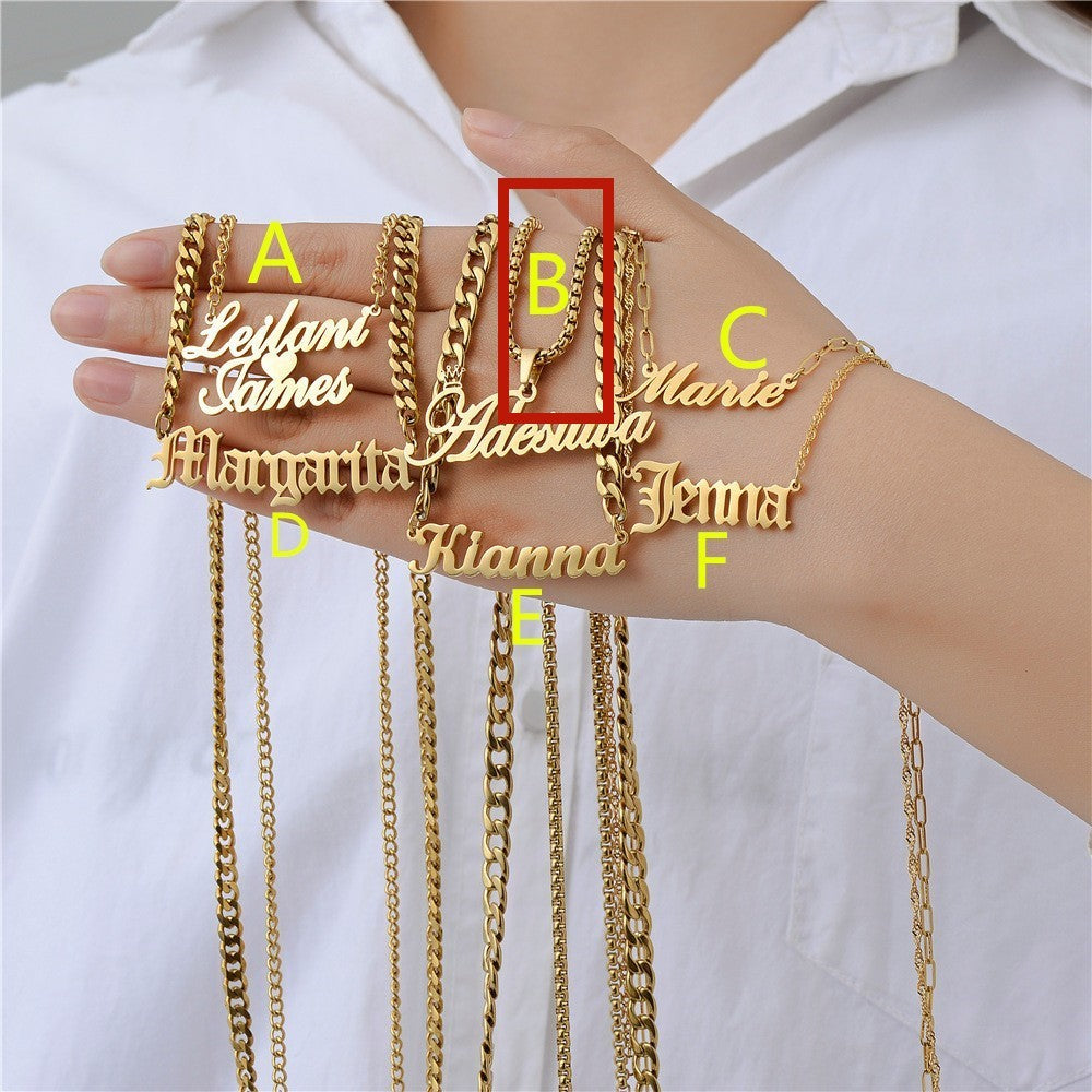Gold personalised necklaces displayed on a hand with a white background