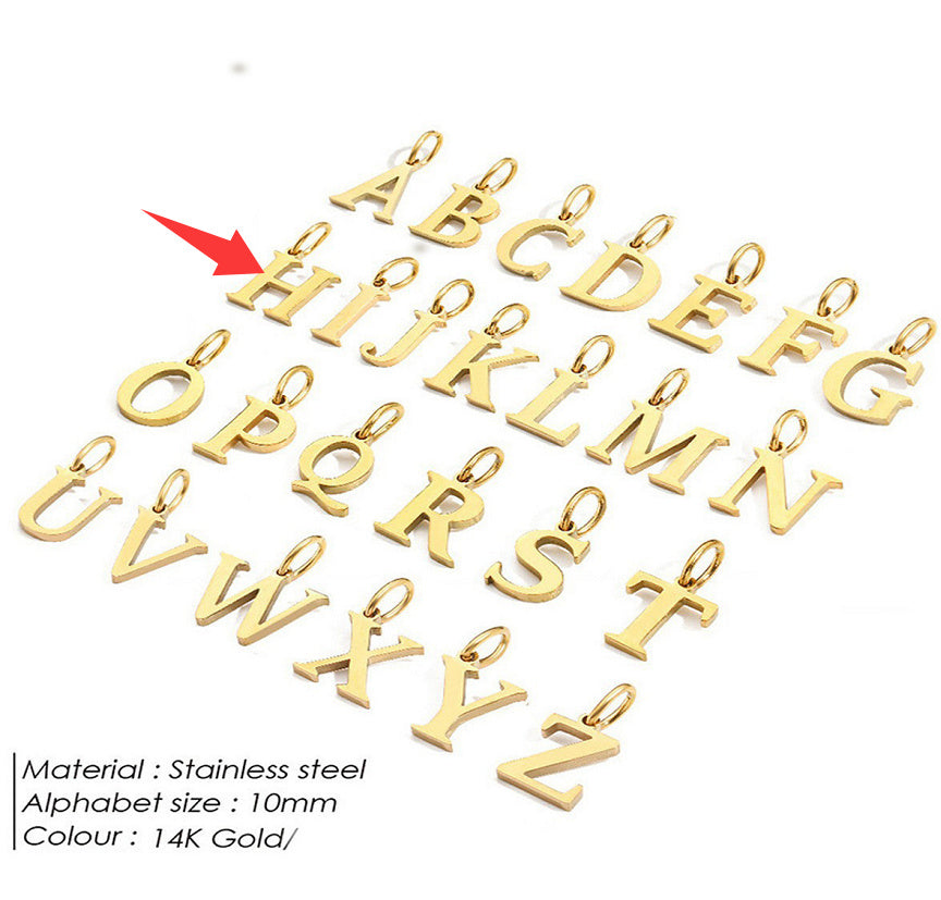 Gold letter pendants for a personalised necklace on a white background with a red arrow pointing to 'H'.