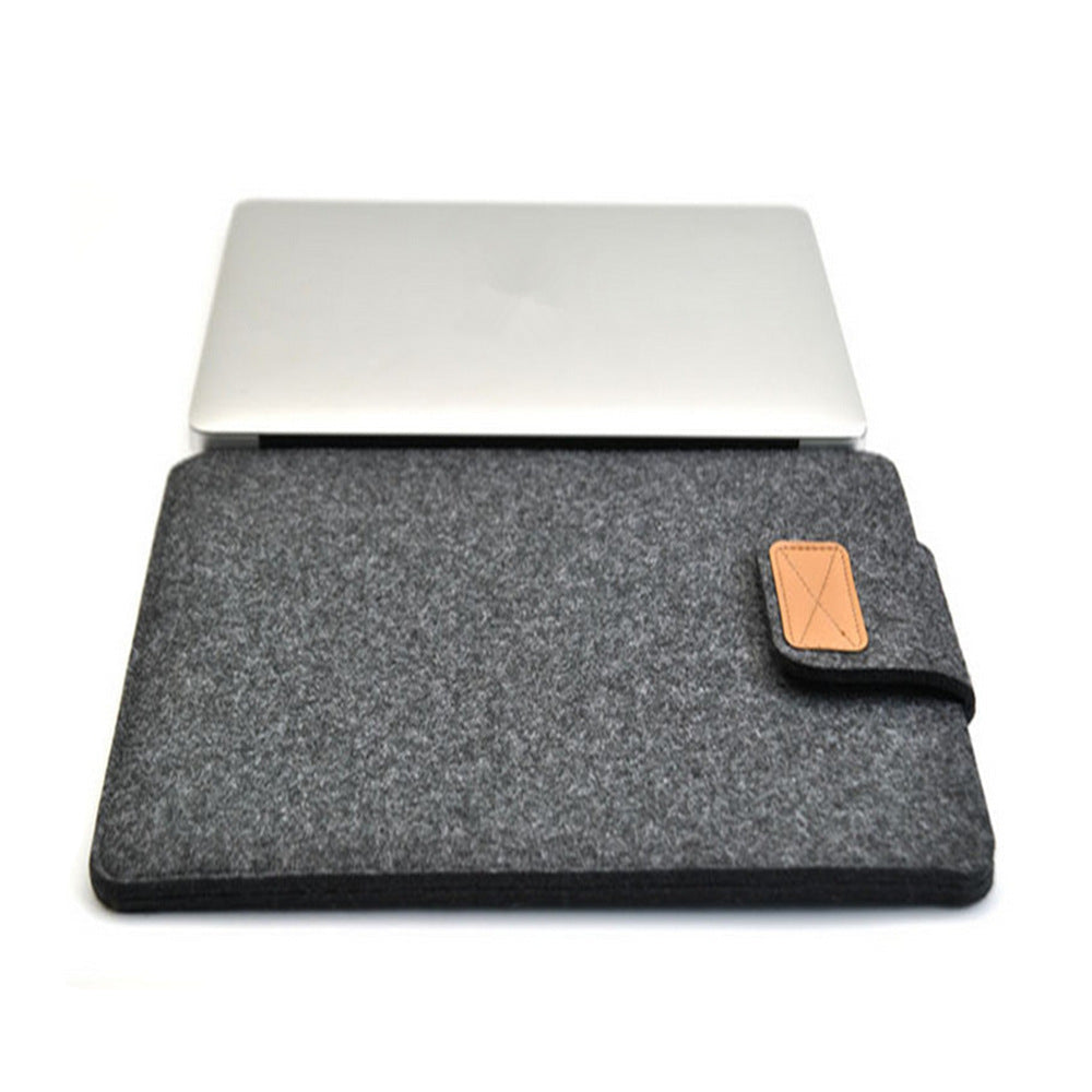 Grey laptop sleeve with a brown patch on a white background