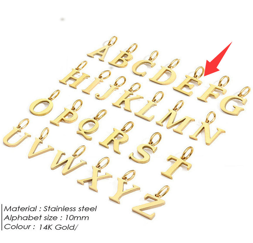 Gold letter pendants for a personalised necklace on a white background with a red arrow pointing to 'E'.