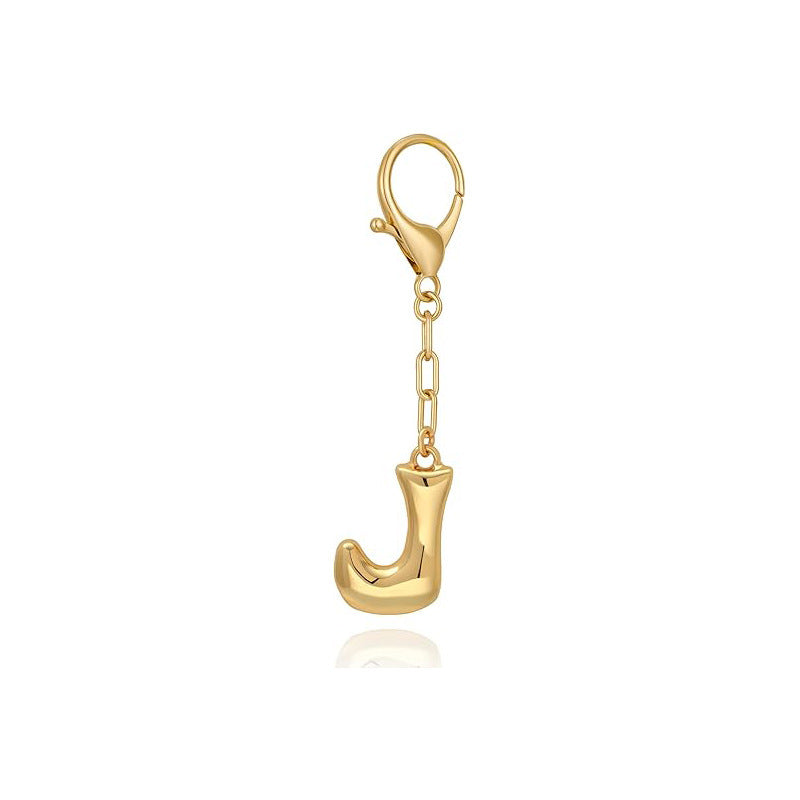 Gold letter 'J' keychain with clasp on a white background
