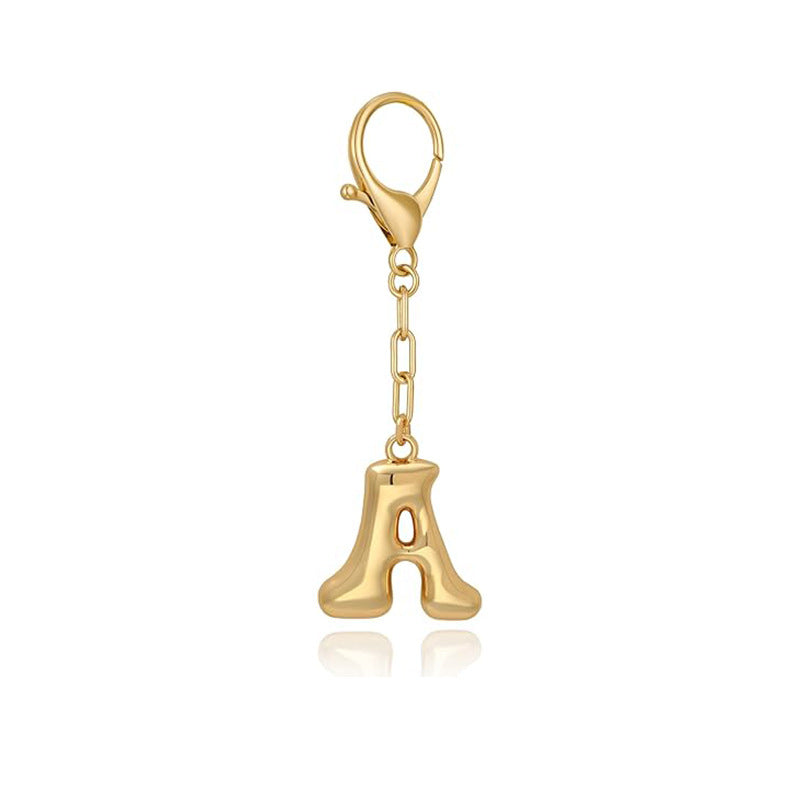 Gold letter 'A' keychain with clasp on a white background