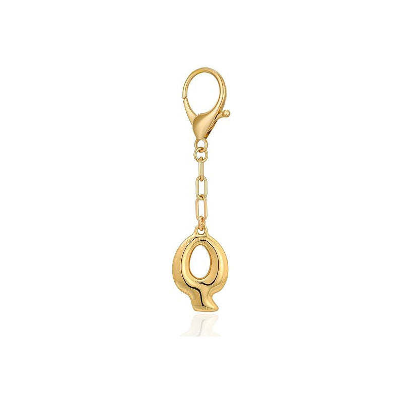Gold letter 'Q' keychain with clasp on a white background