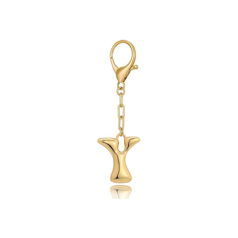 Gold letter 'Y' keychain with clasp on a white background