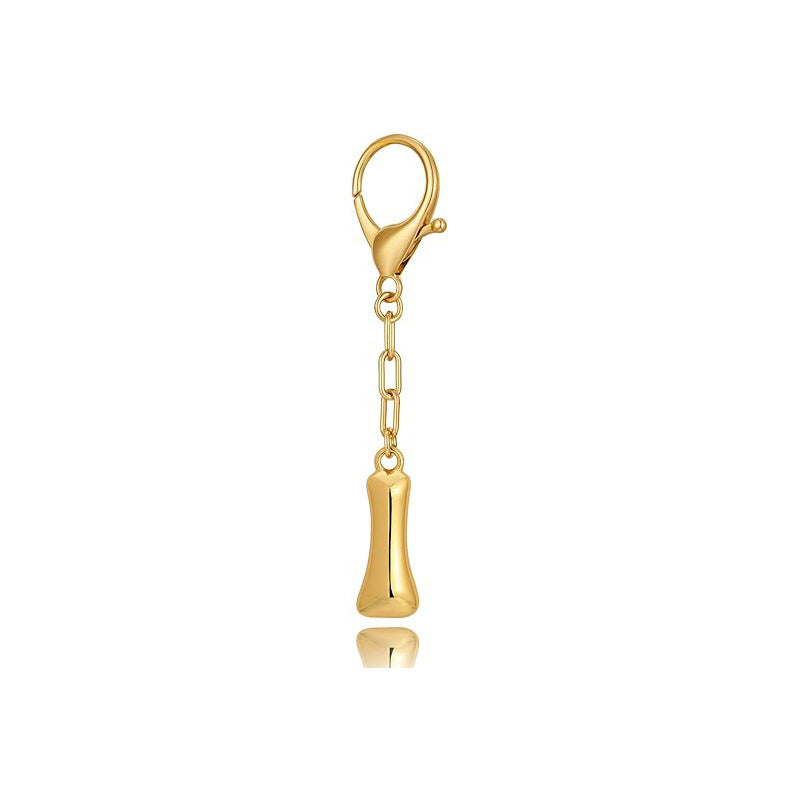 Gold letter 'I' keychain with clasp on a white background