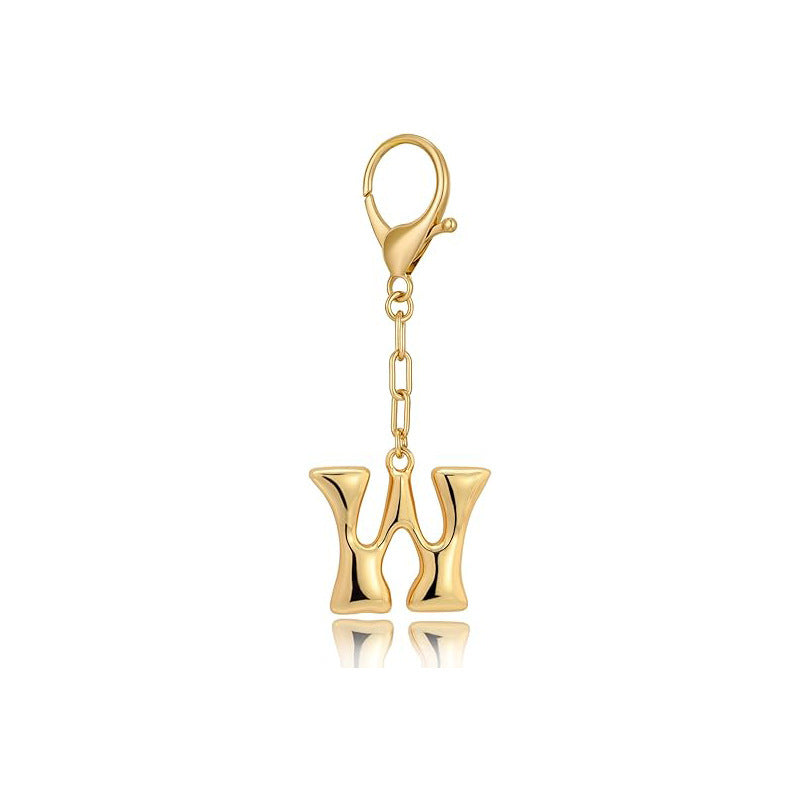 Gold letter 'W' keychain with clasp on a white background
