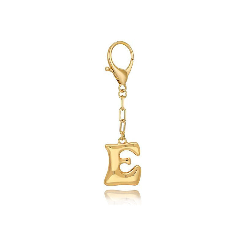Gold letter 'E' keychain with clasp on a white background