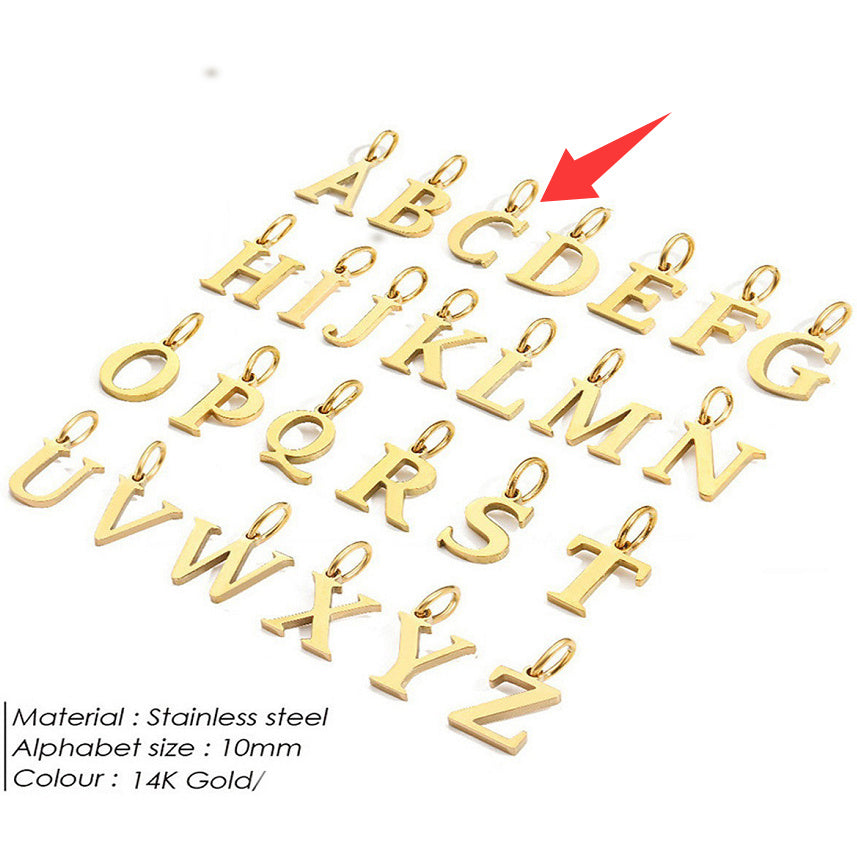 Gold letter pendants for a personalised necklace on a white background with a red arrow pointing to 'C'.