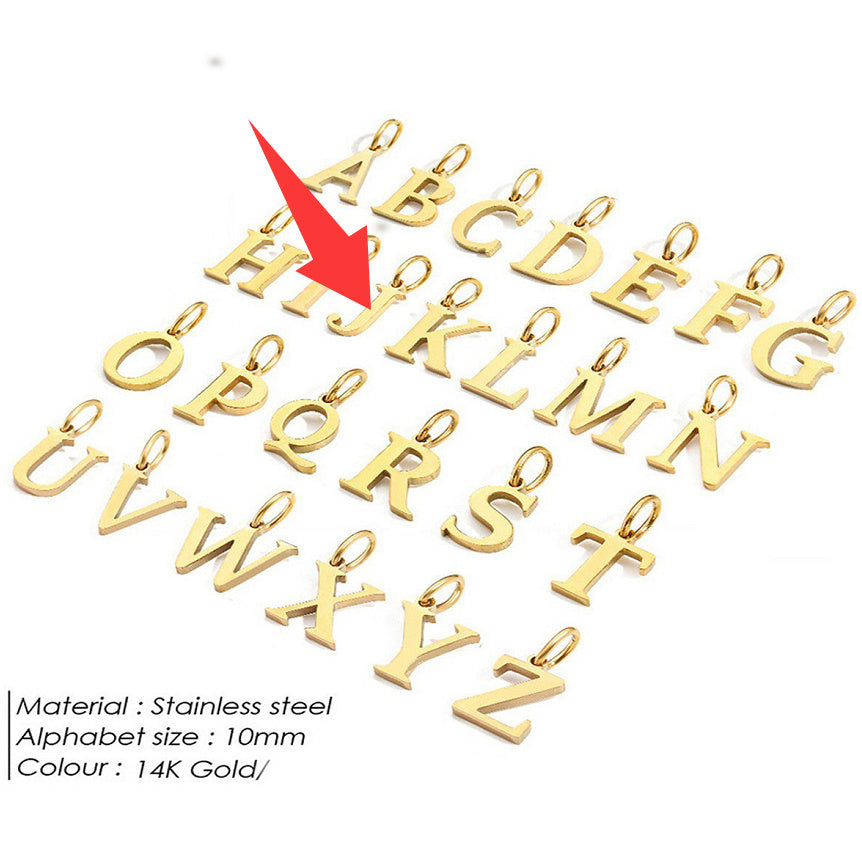 Gold letter pendants for a personalised necklace on a white background with a red arrow pointing to 'J'.